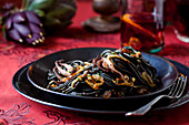 Dinner talbve settign with Black Pasta and Octopus