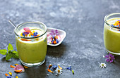 Pineapple and coconut smoothie with wild flowers