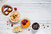 Obatzda (Bavarian cheese spread), jam and chocolate spread with a pretzel and bread