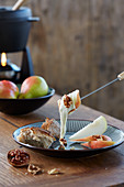 Cheese fondue with pears and nuts