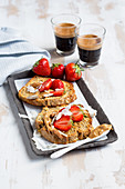 Coconut and almond French toast with strawberries