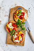 Colourful mini pizza with cocktail tomatoes