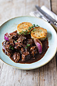 Beef goulash with red onions and thyme dumplings (Bavaria)