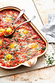 Shakshuka in a baking dish on a baking tray