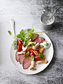 Marinated roast beef with water cress and king trumpet mushrooms
