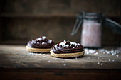 Biscuits with chocolate butter cream and sugar sprinkles (vegan)