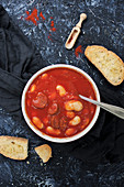 White beans stew with chorizo and tomato sauce