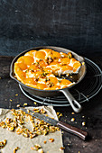 Pan-fried apricot cake with coconut and nut brittle