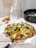 Potato quiche topped with leek and mushrooms