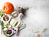 An arrangement of cheese, herbs and spices