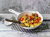 Scrambled egg with courgette, peppers and cherry tomatoes