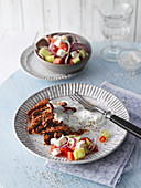 Fried gyros with country salad with a cucumber and yoghurt dip