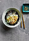 Black and white kingfish poke bowl with black rice and Miso dressing