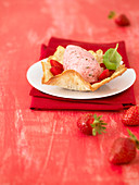 Strawberry and basil mousse with an almond wafer