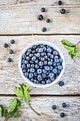 Blueberries in a white cup
