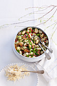 Gnocchi with bacon, peas and onions