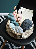 A crocheted basket for wool and embroidery utensils made from string
