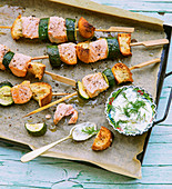 Oven-baked salmon and courgette skewers with a dill and sour cream dip