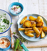 Oven-baked potato wedges with various dips