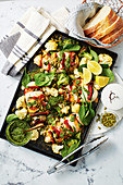Hasselback chicken with lemon-roasted broccoli