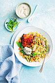 Sticky honey-lime chicken with orange and pistachio couscous