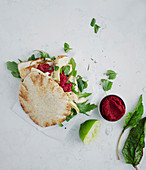 Unleavened bread with chicken and beetroot hummus