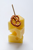 A Bavarian party skewer with emmental and a pretzel