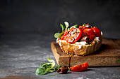 Tomato sourdough sandwich with ricotta and olives