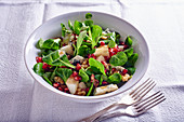 Lamb's lettuce salad with pears, gorgonzola, pomegranate seeds and nuts
