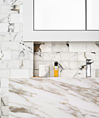 Marble vanity and marble wall tiles in the bathroom