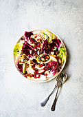 A radicchio salad with chicory, pears, gorgonzola and pomegranate seeds