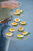 Fried eggs on bread on vintage cake stand