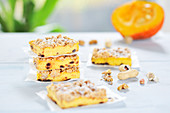 Pumpkin cheesecake bars with walnut and peanut streusel and chocolate drops (vegan)
