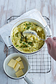 Homemade mashed potatoes with butter in a pot