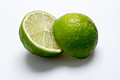 A halved lime on a white surface