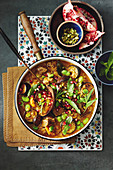 Lamb, eggplant, and freekeh stew with pomegranate seeds (Persia)