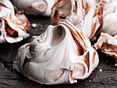 Giant meringues on a wooden background
