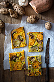 Vegan vegetable cake with turmeric, Jerusalem artichokes, sweet potatoes, spring onions and mushrooms