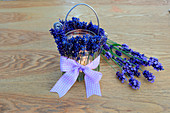 Handmade candle lantern decorated with scented lavender and gingham bow