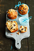 Blueberry muffins on a chopping board