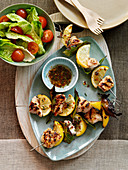 Turkey skewers with lemon and bay leafs
