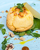 Twice baked cheese souflee with poached pear and walnut