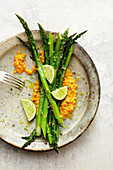 Grilled asparagus on lentil curry