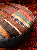 Floor cushion made from pieces of carpet