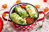 Green cabbage leaves stuffed with mince and rice