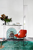 Leather chair in front of the fireplace in the living room