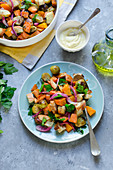 Roasted pumplin, sweet potatoes and brussel sprouts salad with croutons