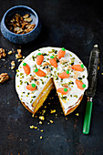 Carrot cake with cream cheese frosting, sliced