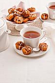 Mini cinnamon rolls, served with tea