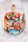 Open salami sandwiches with tomatoes and cream cheese